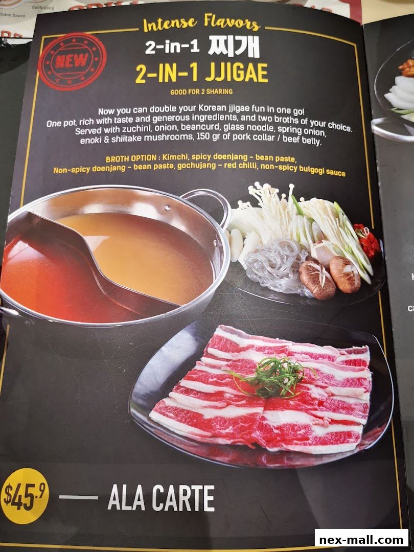 A menu item featuring a split pot of Korean jjigae with raw ingredients and sliced meat.