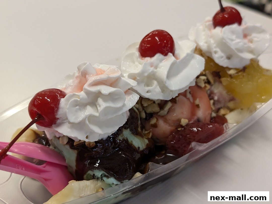 A delicious banana split ice cream sundae with whipped cream, cherries, and nuts.
