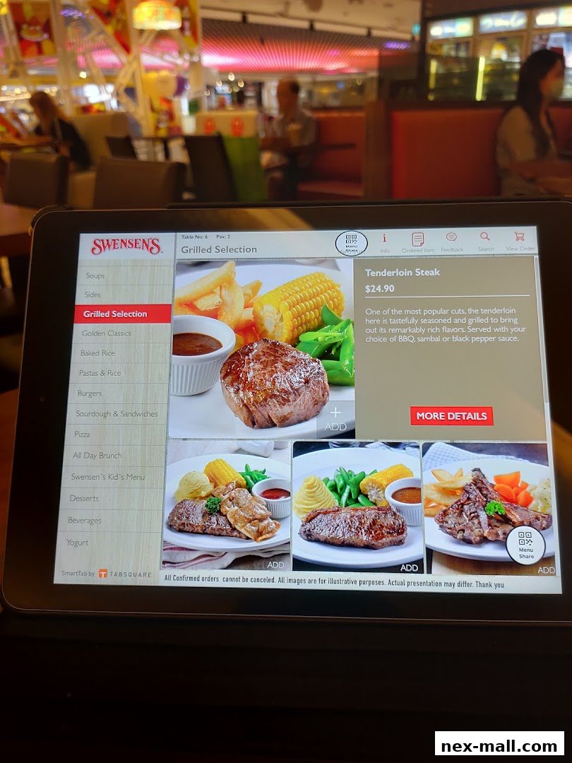 A tablet displays the Swensen's menu, featuring grilled steak and other dishes.