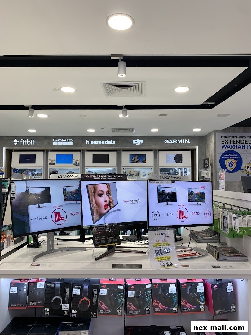 A display of LG monitors and ASUS gaming accessories at COURTS Nex Serangoon.