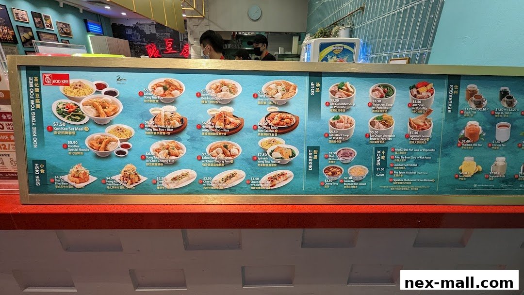A menu board for Koo Kee Yong Tow Foo Mee, showcasing various dishes and beverages.