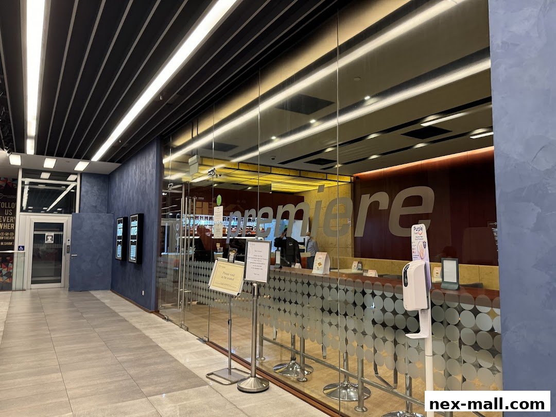 The entrance and counter area of Shaw Theatres NEX, with glass doors and signage.