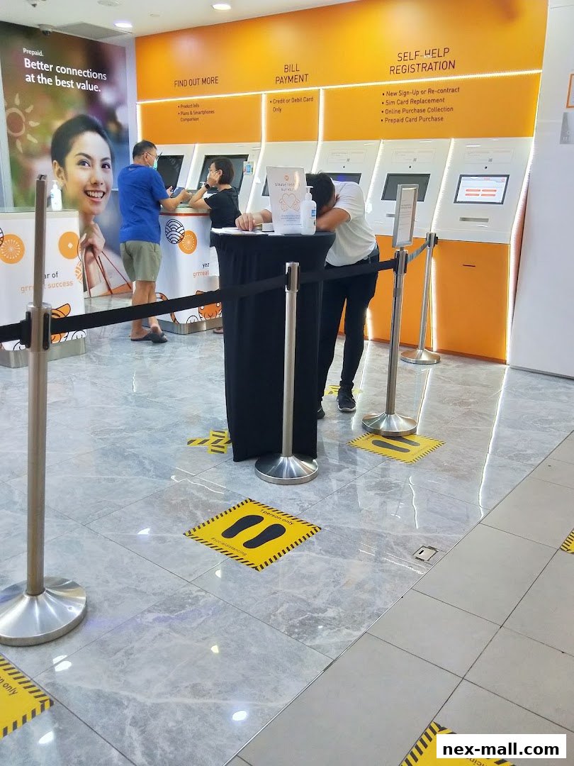 Customers interact with self-service kiosks at a phone shop and internet service provider.