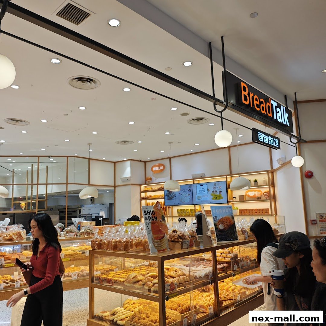 Interior view of a BreadTalk bakery with a wide selection of fresh bread and pastries.