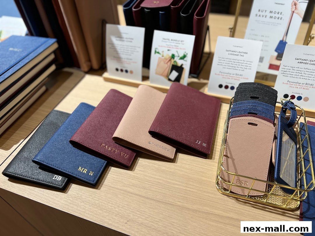 Personalized leather travel accessories like passport covers and luggage tags are displayed.