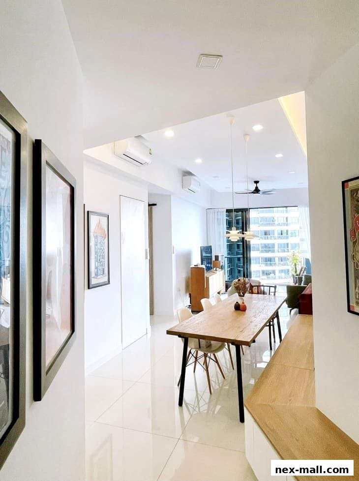 A modern dining area with a long wooden table and chairs, overlooking a city view.