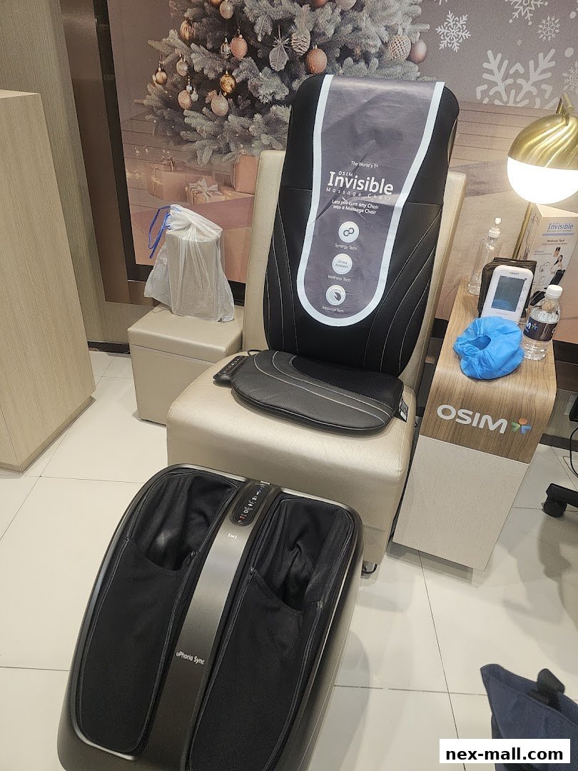 OSIM massage chair and foot massager displayed with festive holiday decorations.