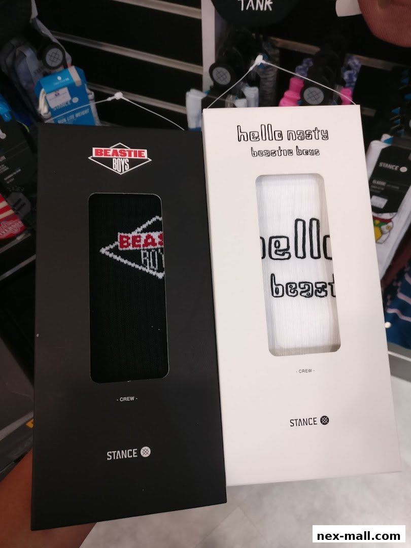 Two pairs of Stance socks, one Beastie Boys themed and one with 'hello nasty' text.