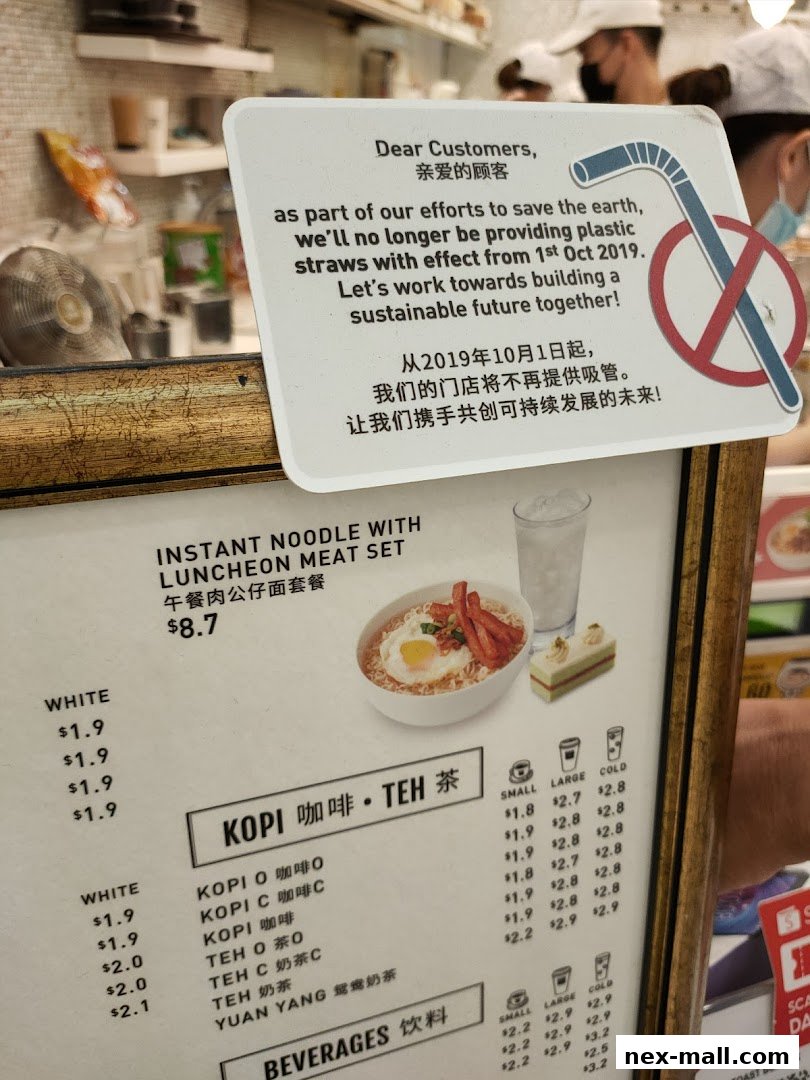 A menu board at Toast Box NEX displays food and beverage options with prices.