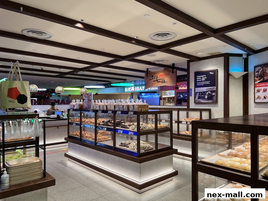 Interior of a Japanese bakery showcasing a variety of fresh baked goods in display cases.