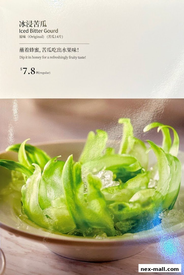 A close-up of Iced Bitter Gourd served with honey, presented in a bowl with crushed ice.