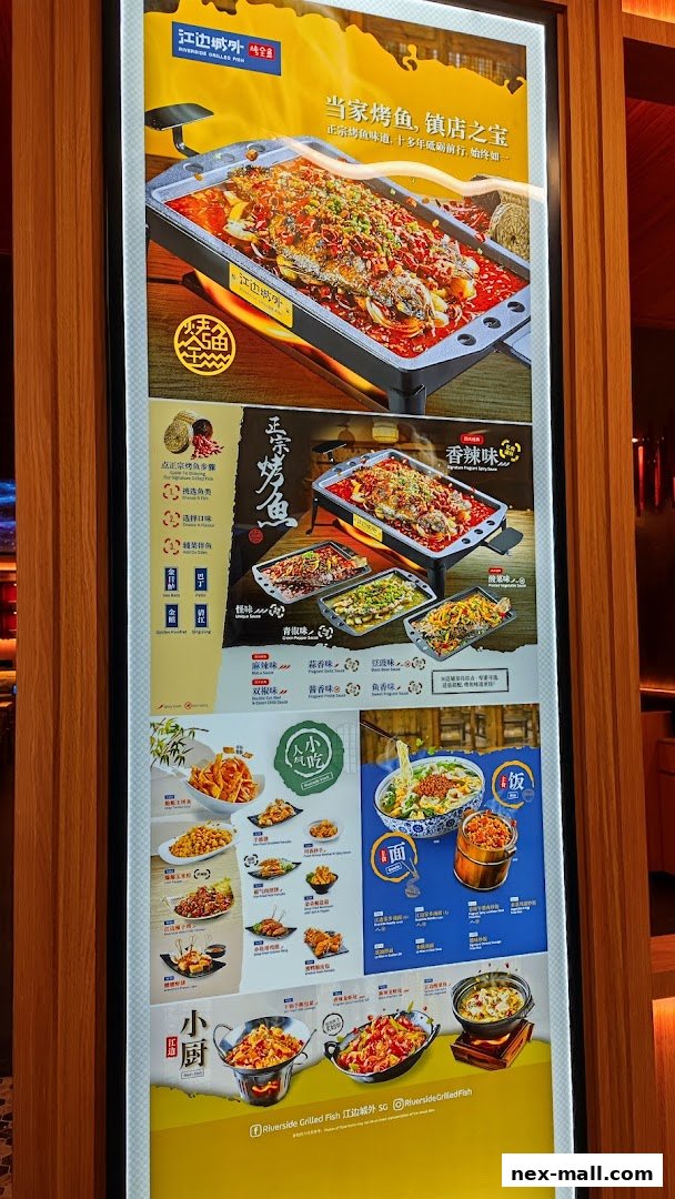 A brightly lit menu board showcasing various grilled fish dishes and other Chinese cuisine.