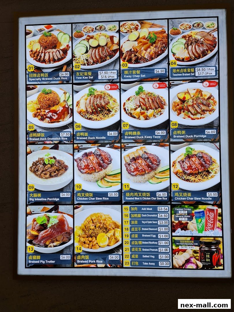 A menu board displaying various braised duck and char siew dishes with prices.