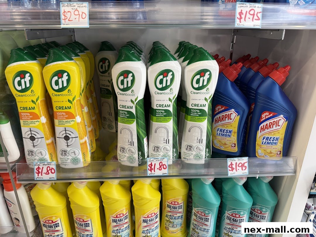Shelves stocked with cleaning products including Cif cream cleaner and Harpic toilet cleaner.