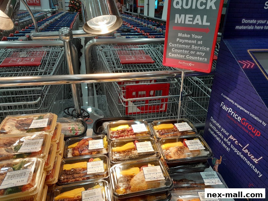 Pre-packaged meals and rows of shopping carts at FairPrice Xtra.