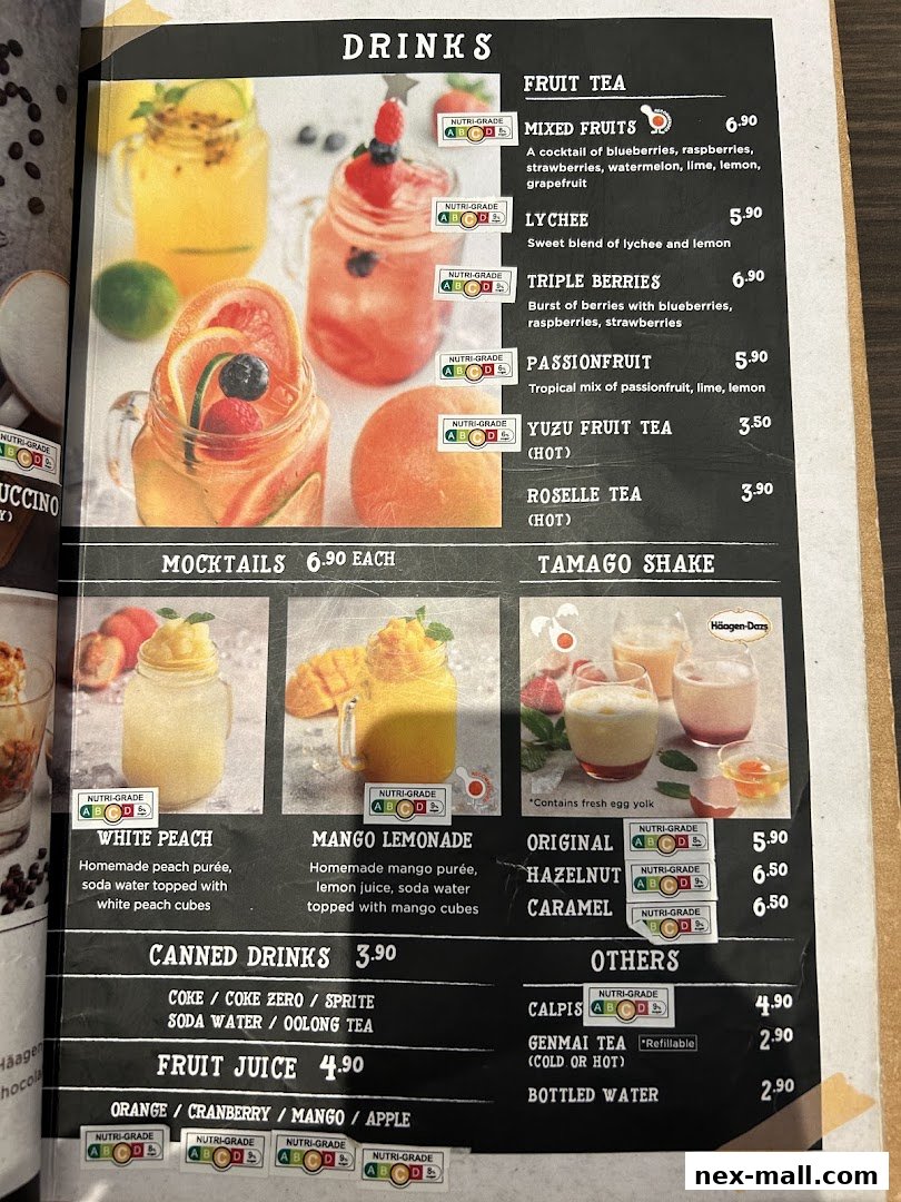 A menu page displaying various drinks including fruit teas, mocktails, shakes, canned drinks, and fruit juices.