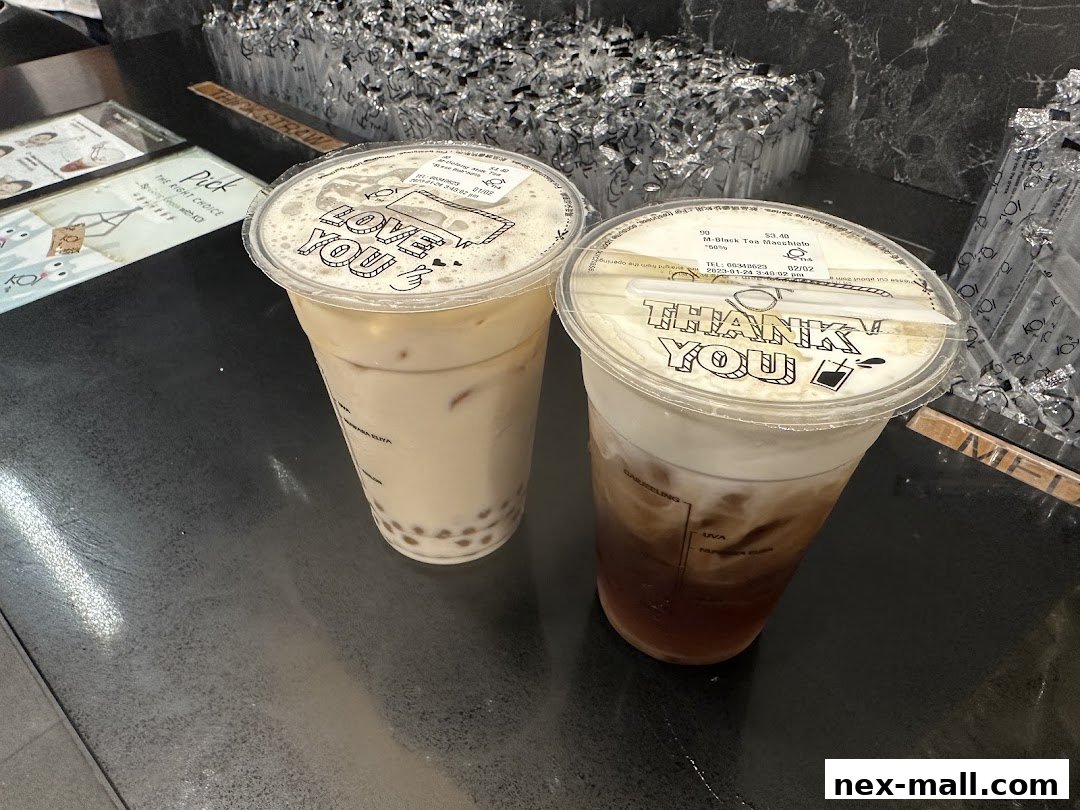 Two bubble tea drinks with 'Love You' and 'Thank You' printed on the lids.