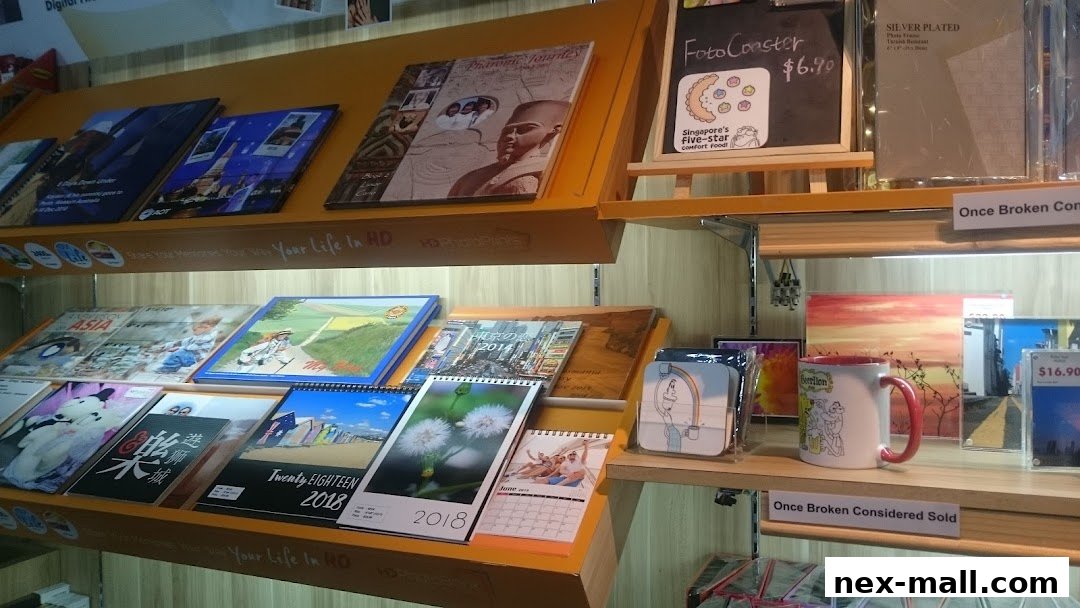A display of calendars, coasters, and mugs with various designs and themes.