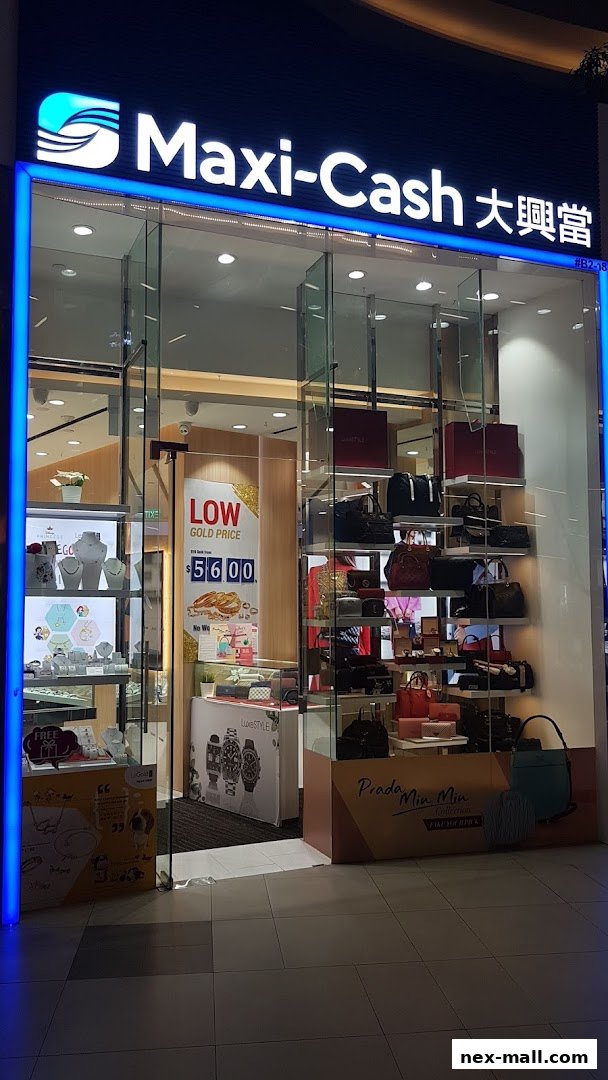 The exterior of a Maxi-Cash store showcasing jewelry, handbags, and watches.