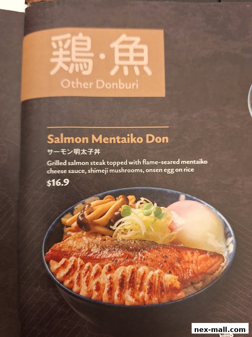 A menu item featuring grilled salmon steak with mentaiko cheese sauce and mushrooms.