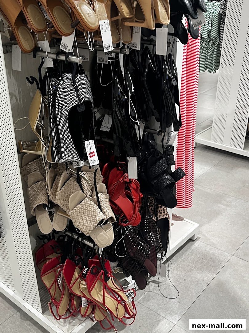 A display of various women's sandals and shoes in different styles and colors.