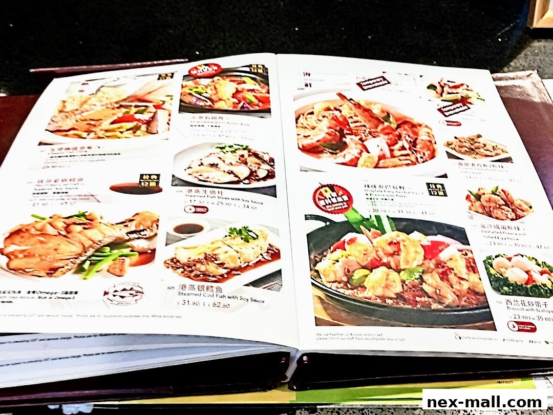A menu from Dian Xiao Er NEX featuring various seafood and meat dishes with appetizing photos.