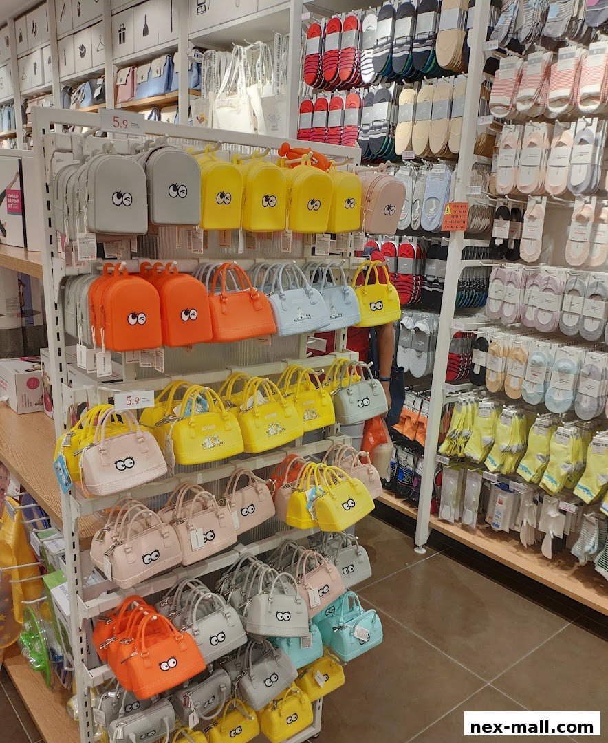 A colorful display of various bags and socks in a retail store.