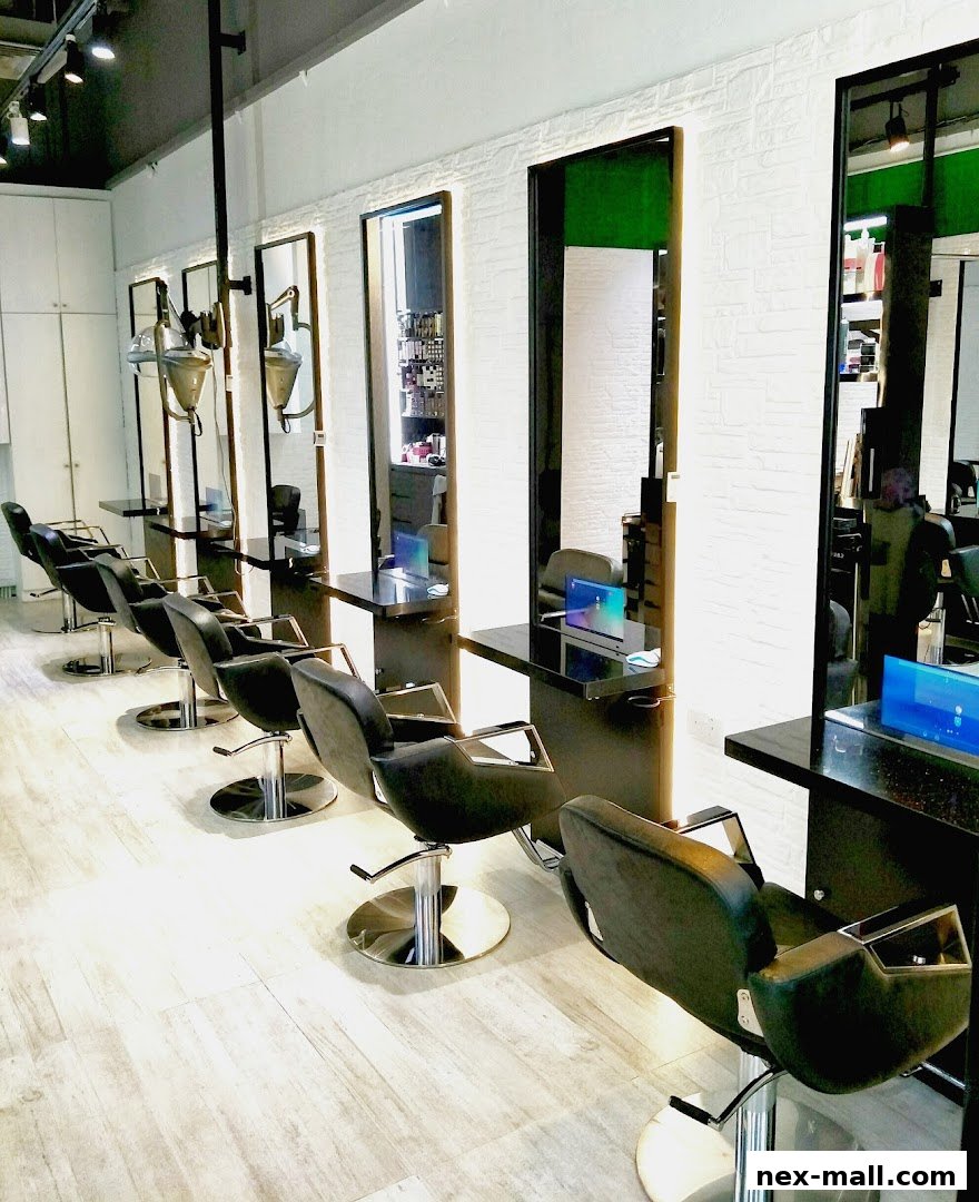 Interior view of a modern hair salon with multiple styling stations and chairs.