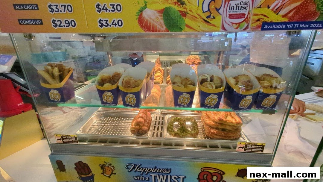 A display case filled with various pretzels and pretzel bites from Auntie Anne's.