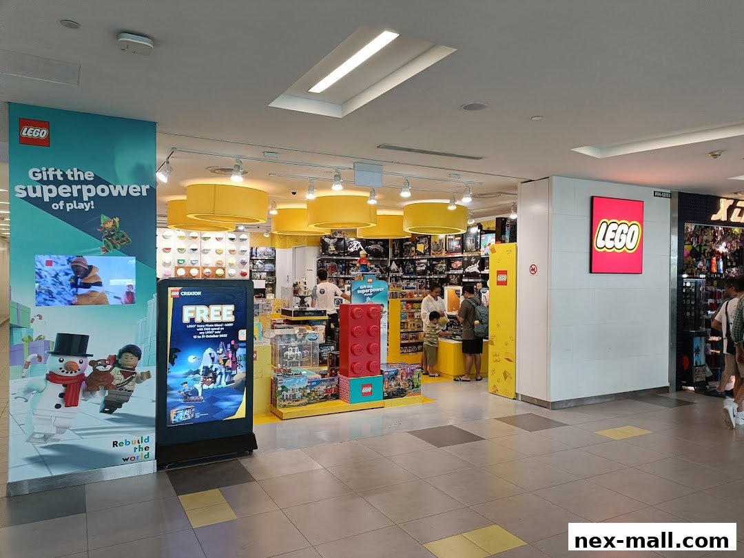 The entrance to a brightly lit LEGO Certified Store with displays of LEGO sets and promotional materials.