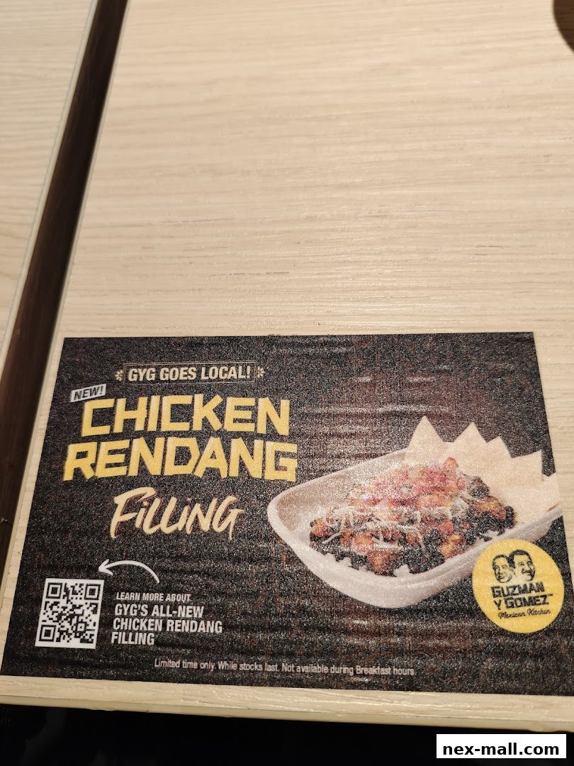 A promotional flyer for Guzman y Gomez's new Chicken Rendang Filling.