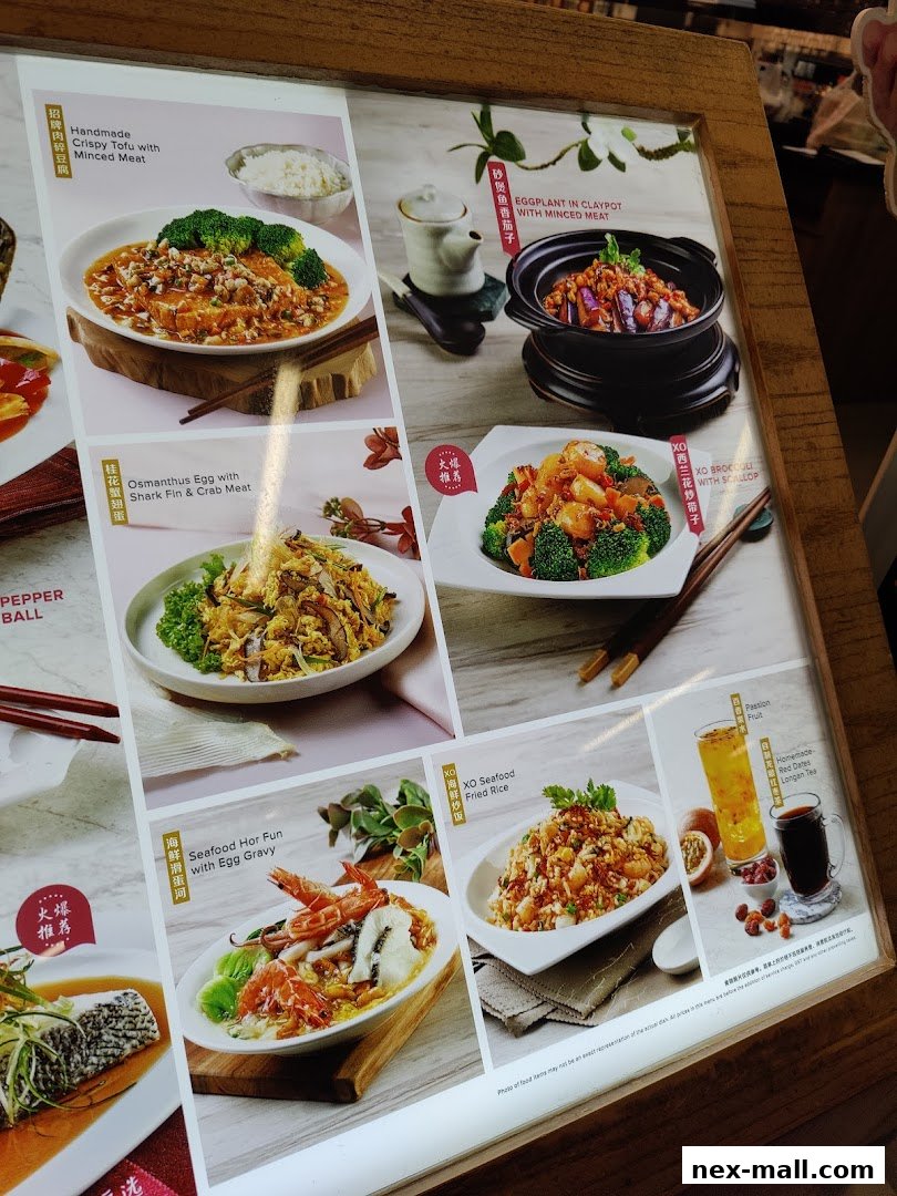 A menu board displaying various Chinese dishes with appetizing food photography.