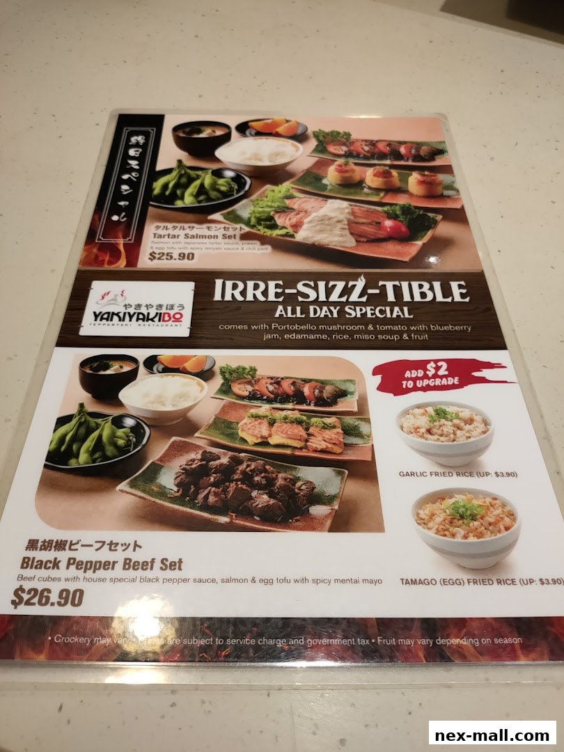 A menu from Yaki Yaki Bo featuring a Tartar Salmon Set and Black Pepper Beef Set.
