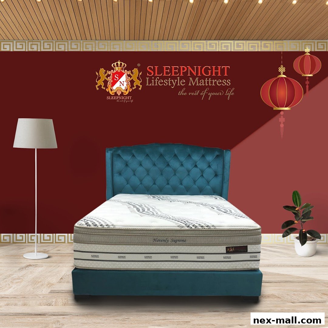 A luxurious mattress on a teal bed frame with a stylish headboard, in a room with decorative elements.