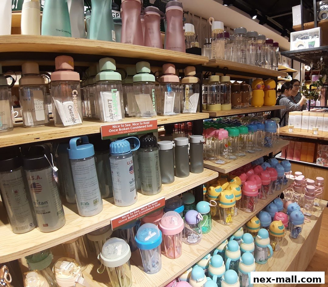 Shelves filled with colorful reusable water bottles and drinkware in various designs.
