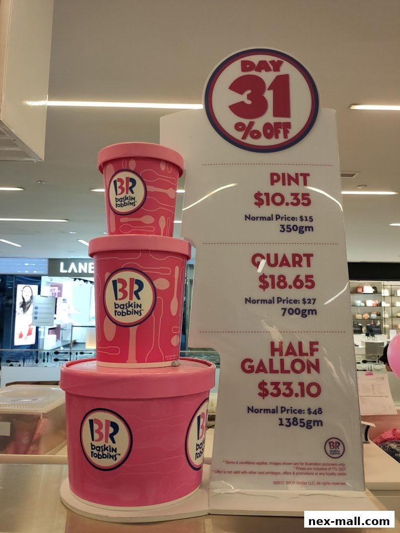 Baskin-Robbins ice cream tubs stacked with a promotional sign showing discounts.