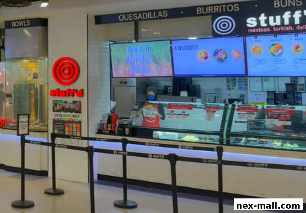 The Stuff'd shop counter with menu screens and food displays.