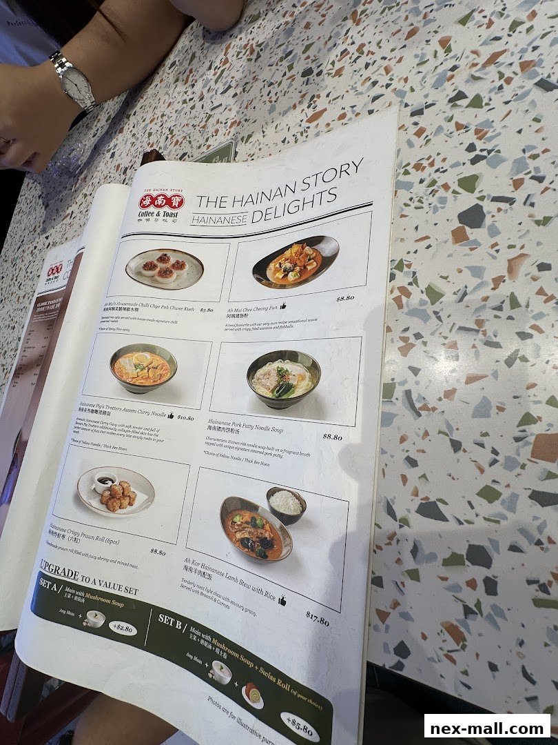 A menu from The Hainan Story Coffee House featuring Hainanese Delights with food images and prices.
