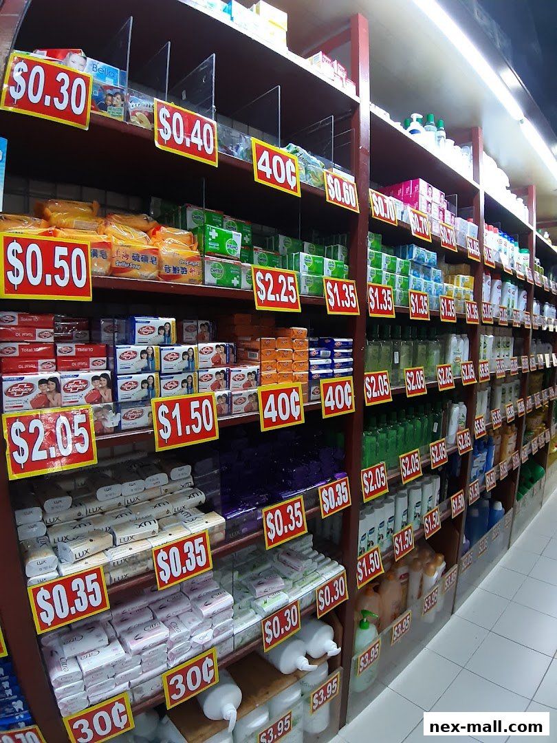 Shelves stocked with various soaps, detergents, and personal care products with price tags.