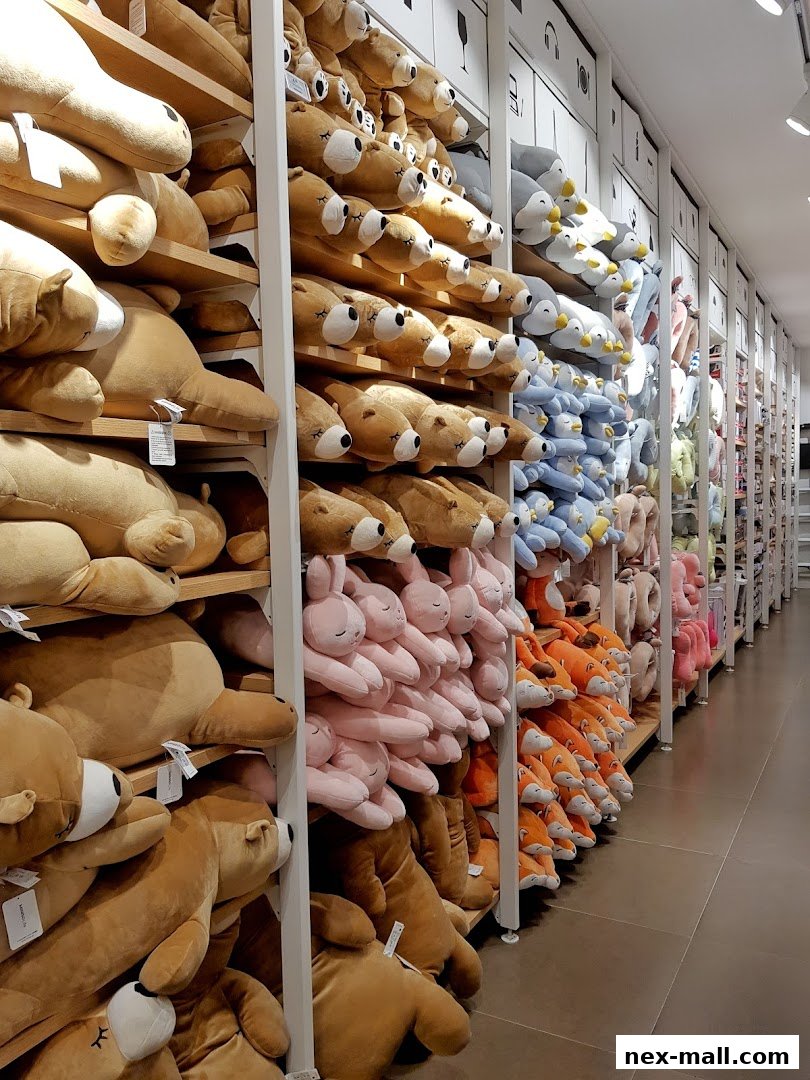 A wide selection of plush toys, including bears, bunnies, and foxes, neatly displayed on shelves.