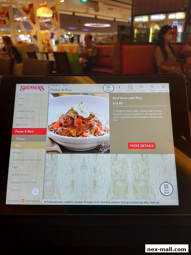A tablet displays the Swensen's menu, featuring Beef Stew with Rice.
