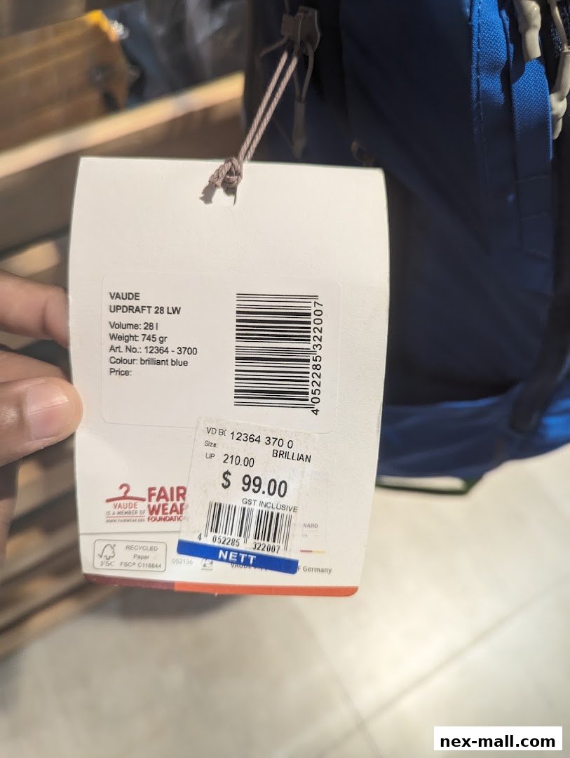 A price tag for a VAUDE UPDRAFT 28 LW backpack is shown.