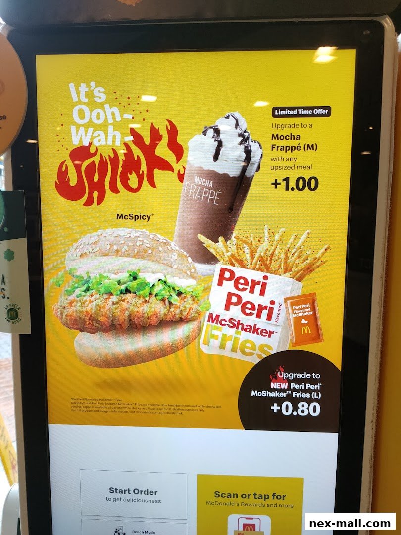 McDonald's digital menu displaying McSpicy burger, Mocha Frappé, and Peri Peri McShaker Fries.