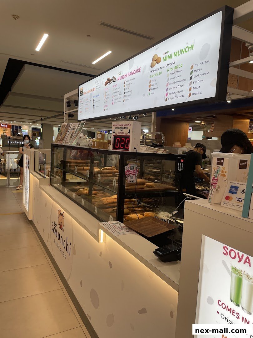 A brightly lit pancake shop counter with a menu board displaying various pancake options.