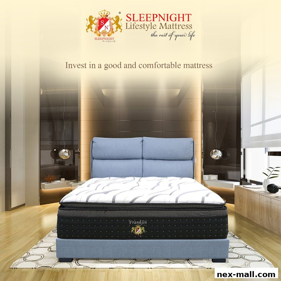 A stylish bedroom scene featuring a SLEEPNIGHT Lifestyle Mattress with a blue headboard.