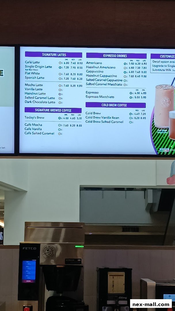 A menu board displaying various coffee and espresso drinks with prices.