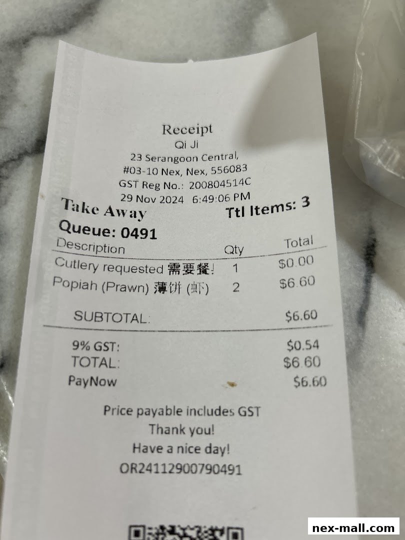 A receipt from Qi Ji showing a take-away order with Popiah (Prawn).