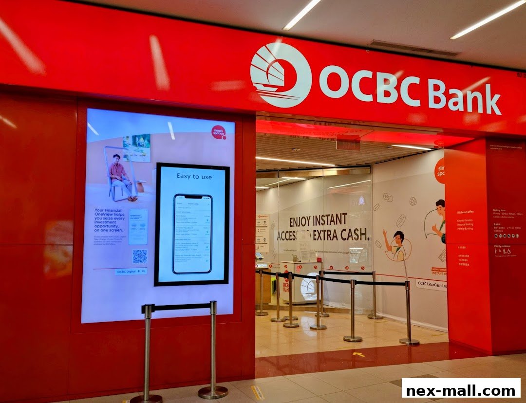 The entrance of OCBC Bank NEX branch with promotional displays and banking services information.