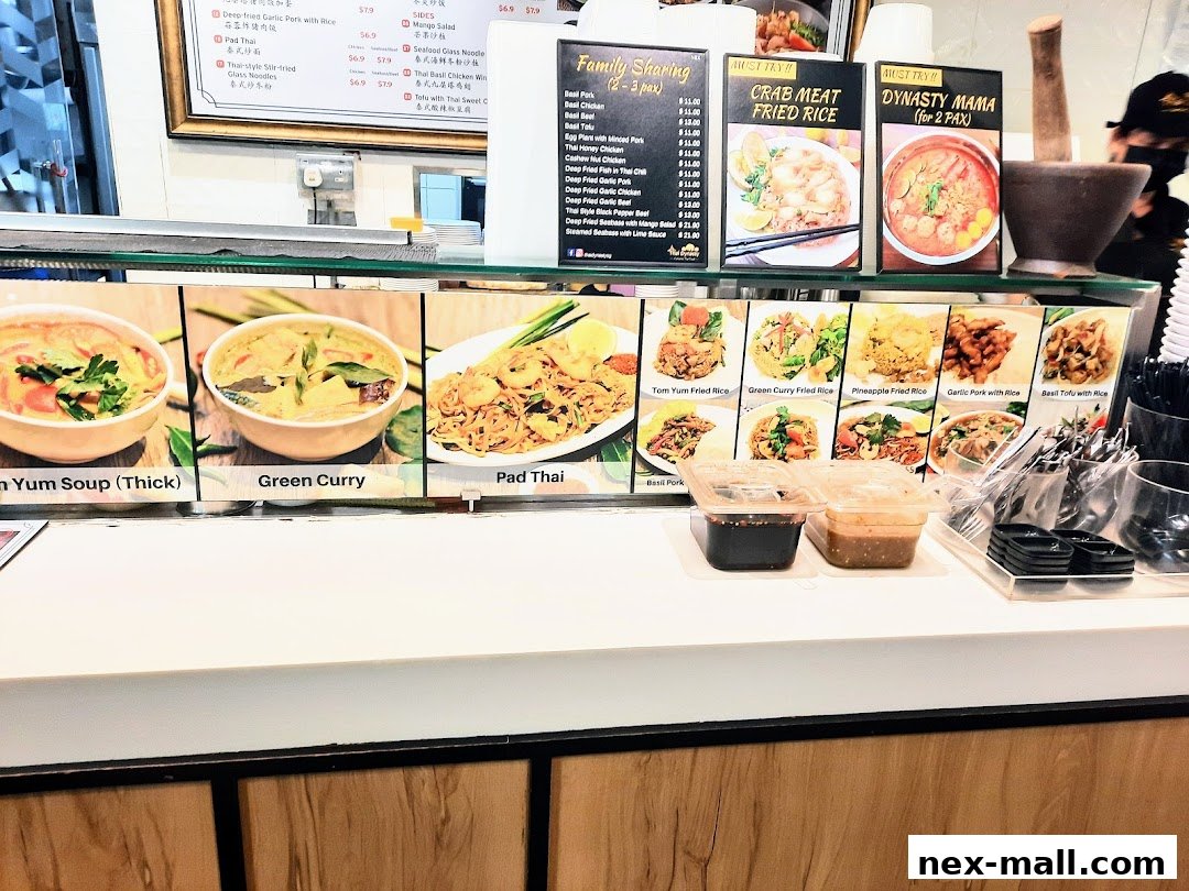 A display of various Thai dishes with appetizing photos and names.