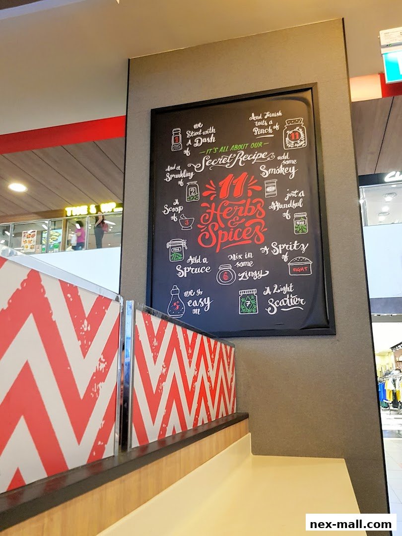 A chalkboard sign detailing KFC's secret recipe of 11 herbs and spices.